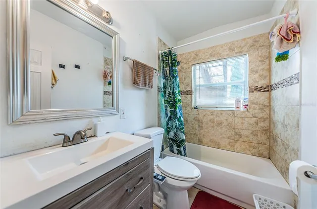 a bathroom with a sink a toilet and a bathtub