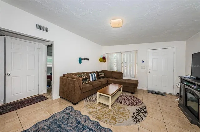a living room with furniture and a rug
