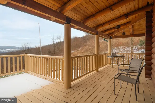 a dining room with furniture and a wooden floor