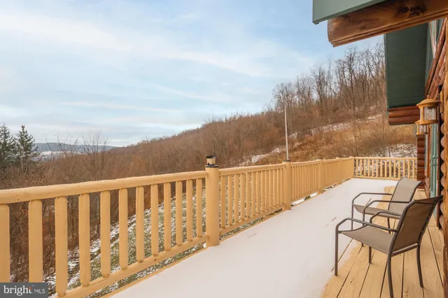 a view of a kitchen with stainless steel appliances granite countertop a stove and a refrigerator