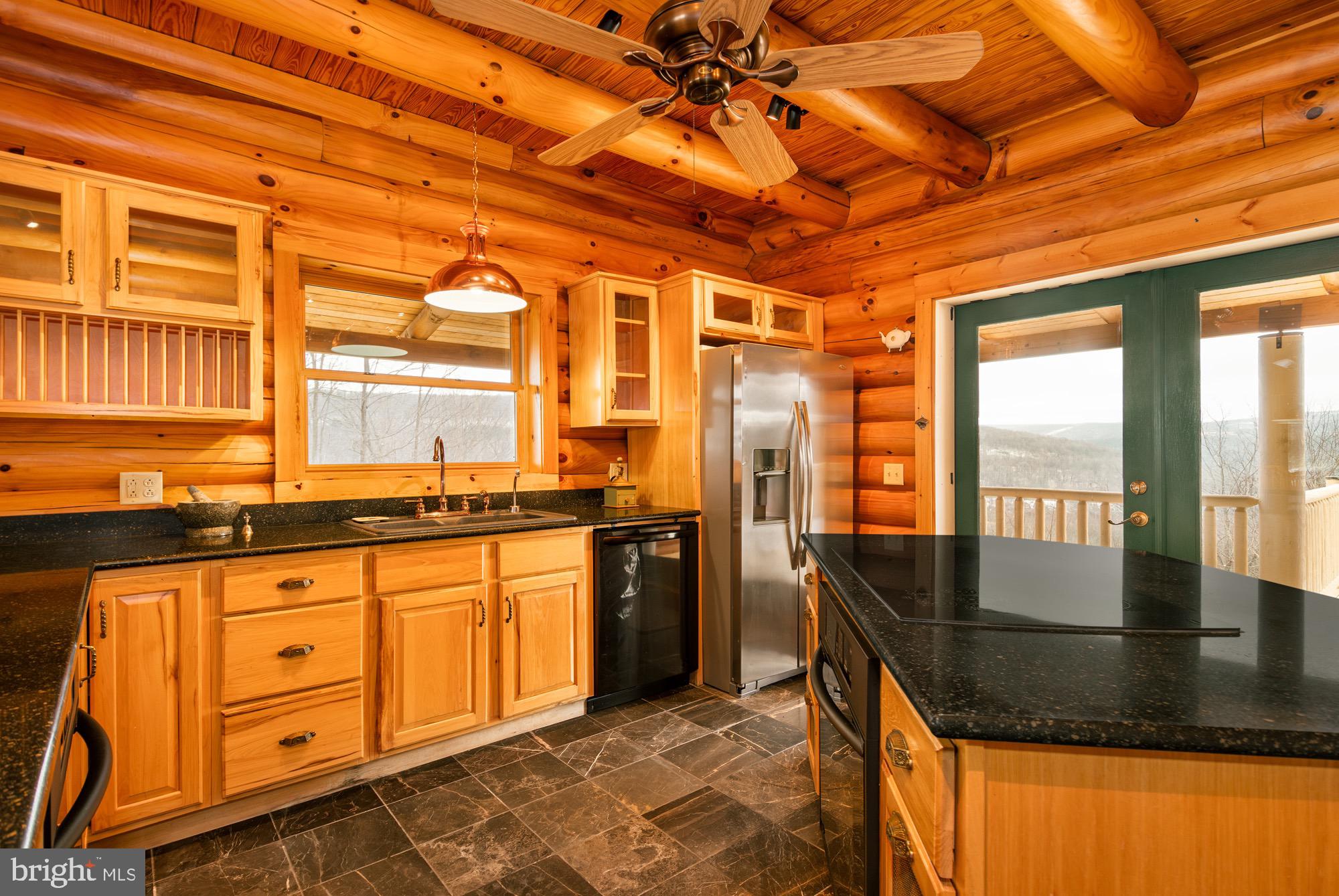 17051 Laurel Run Road Southwest Barton, MD 21521 - Photo 27 of 77 a kitchen with stainless steel appliances granite countertop a stove a sink and a granite counter tops with large windows