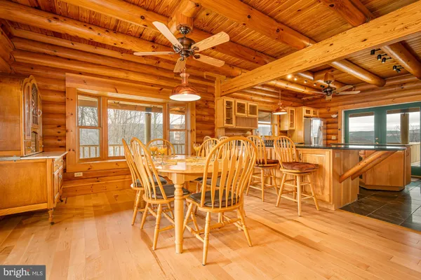 a large room with wooden floor and sliding door