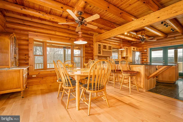 a large room with wooden floor and sliding door