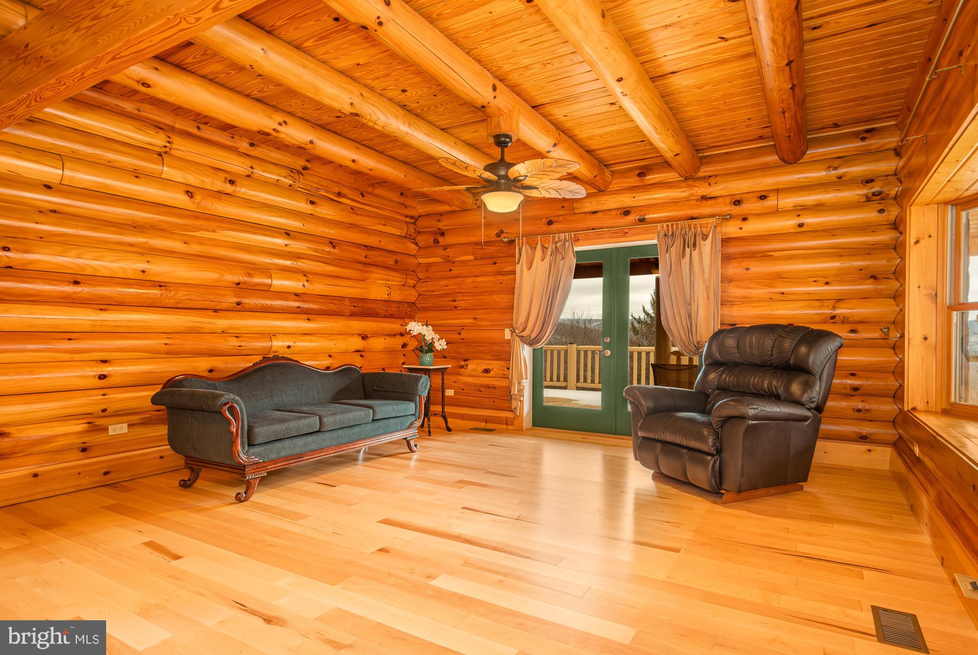 17051 Laurel Run Road Southwest Barton, MD 21521 - Photo 36 of 74 a living room with furniture and a flat screen tv