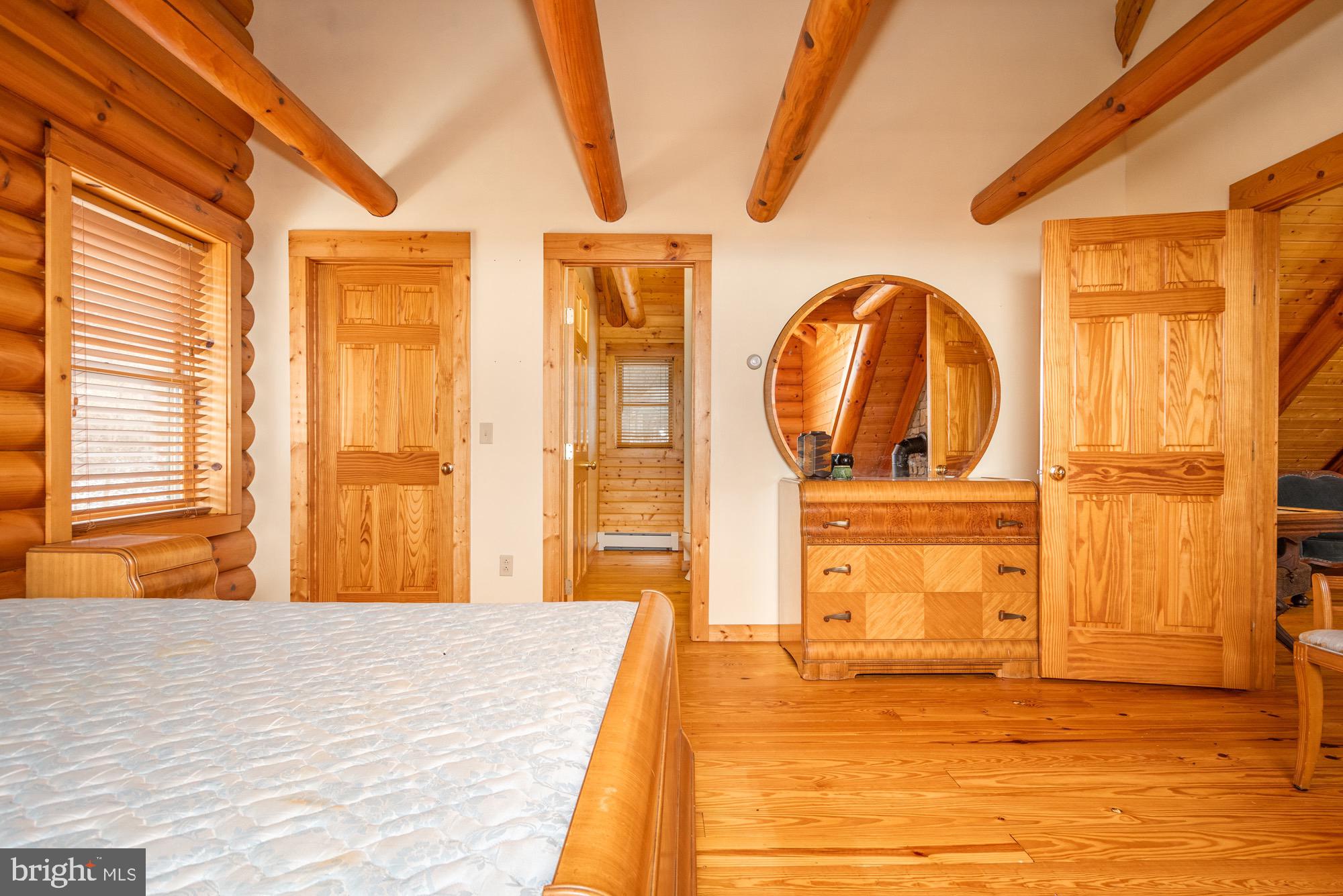 17051 Laurel Run Road Southwest Barton, MD 21521 - Photo 51 of 77 a large room with wooden floor and sliding door