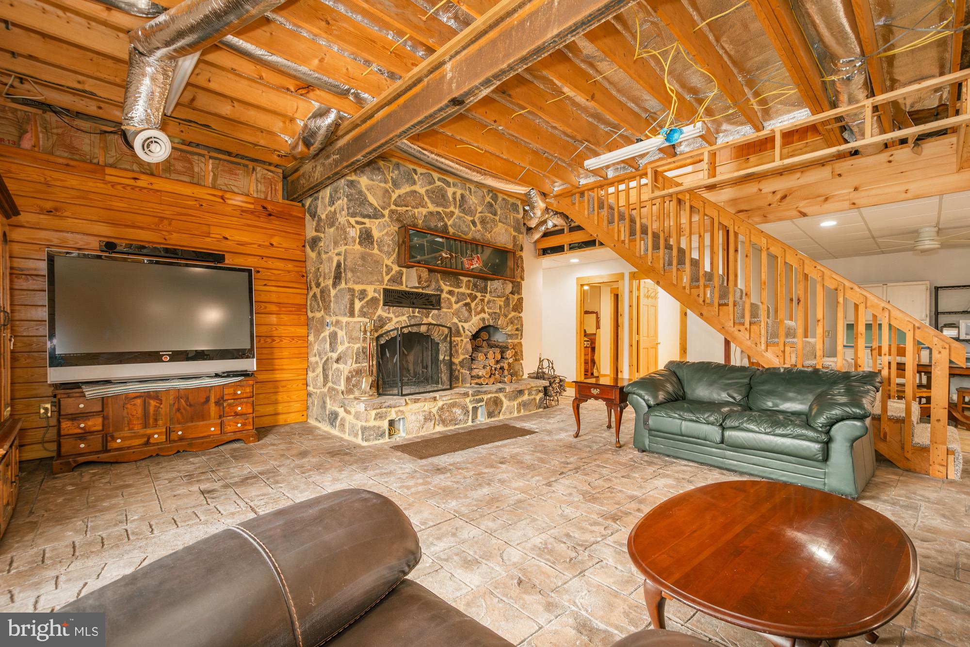 17051 Laurel Run Road Southwest Barton, MD 21521 - Photo 58 of 74 a living room with furniture and a flat screen tv