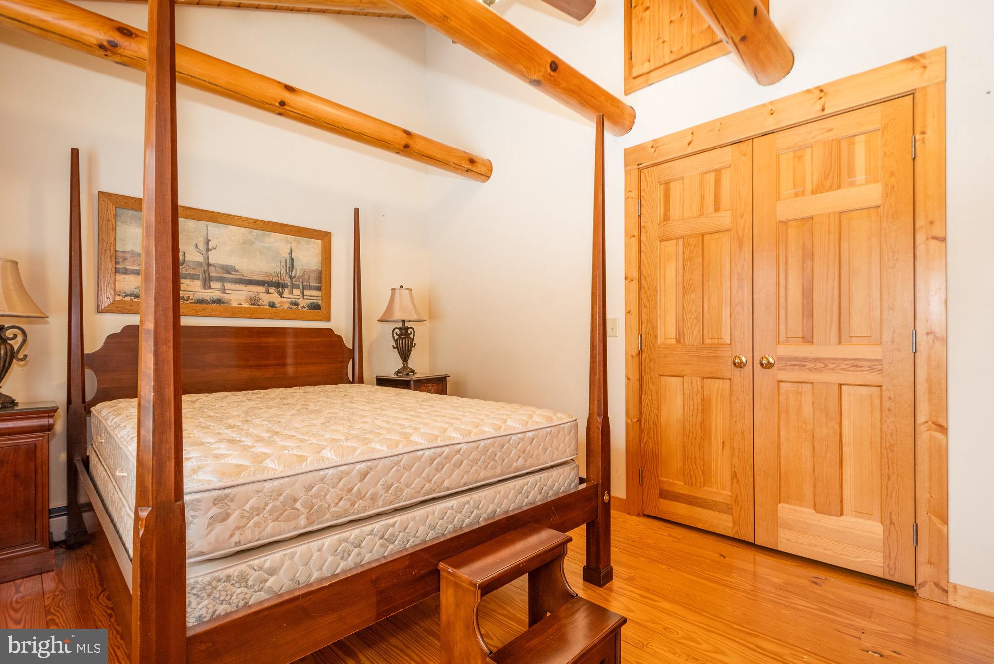 17051 Laurel Run Road Southwest Barton, MD 21521 - Photo 59 of 77 a bedroom with a bed and a window