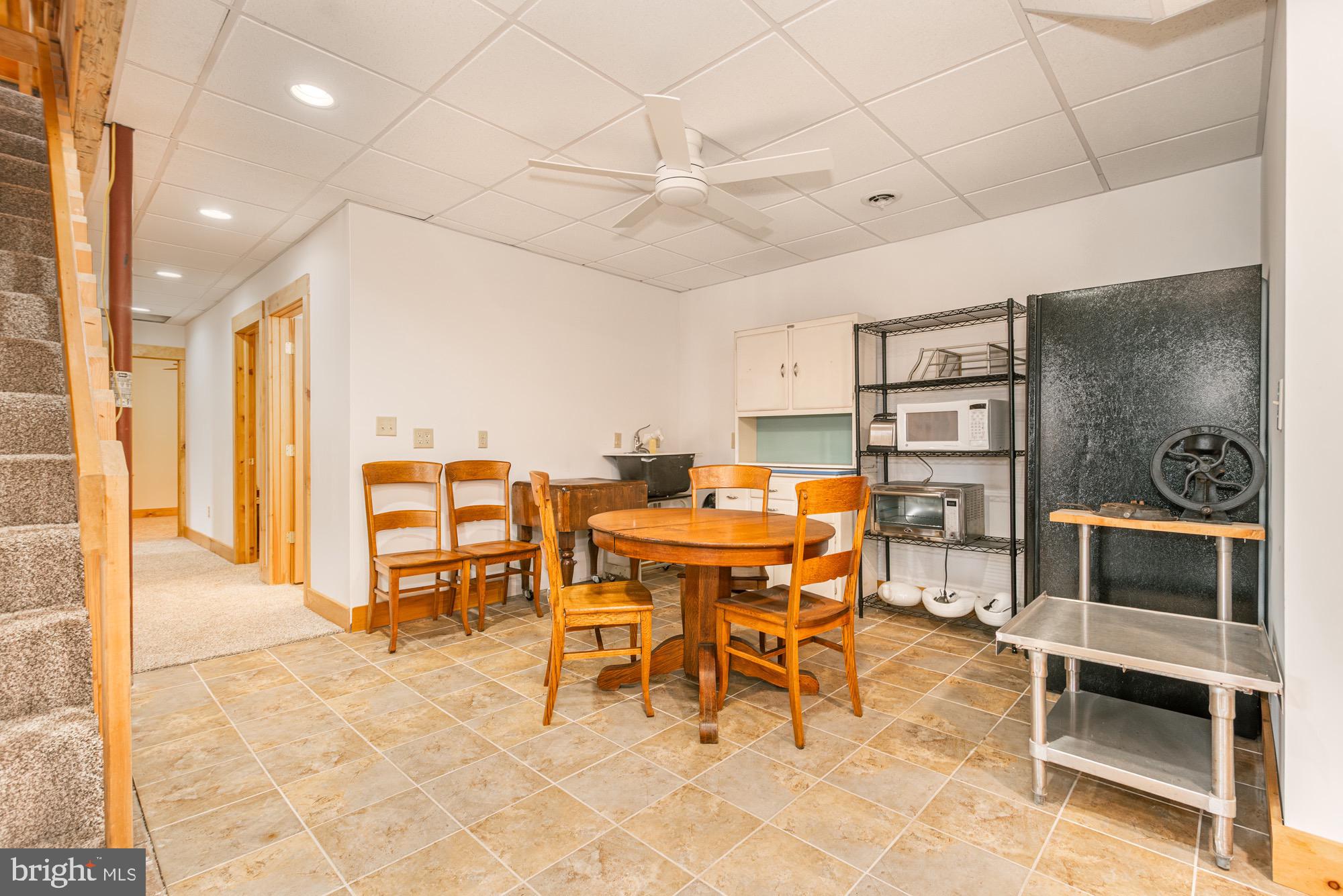 17051 Laurel Run Road Southwest Barton, MD 21521 - Photo 64 of 77 a dining room with furniture and a floor to ceiling window