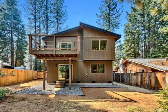 a view of a house with a sink and yard