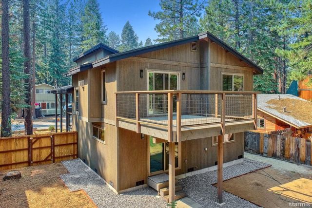 a view of house with backyard