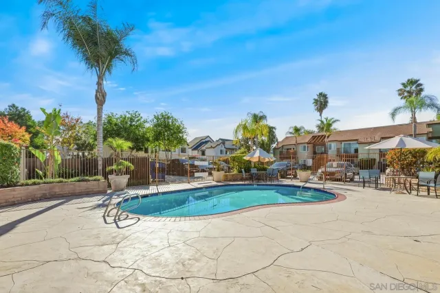 a view of a swimming pool with an outdoor seating