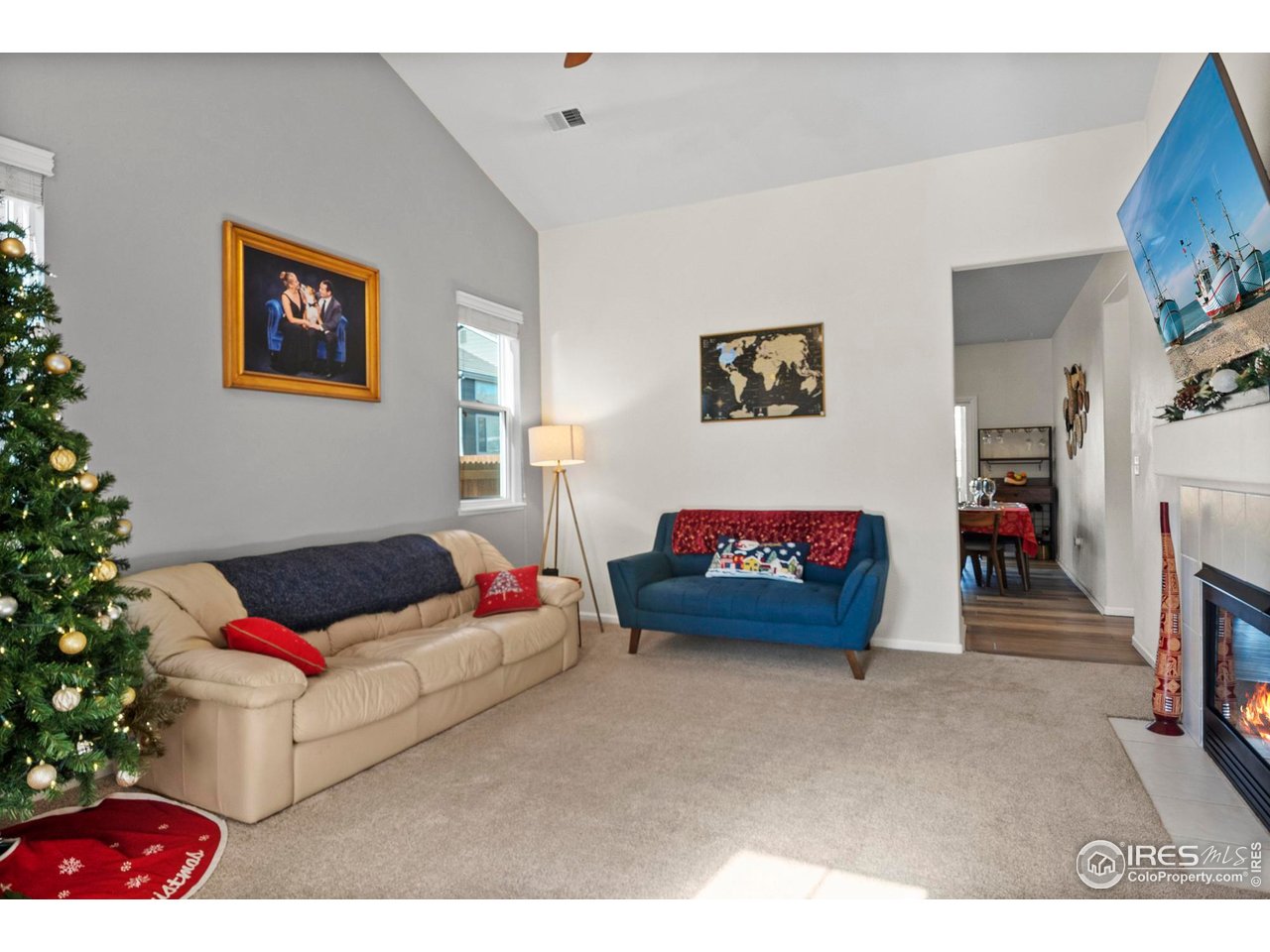 3926 Rannoch Street Fort Collins, CO 80524 - Photo 6 of 25 Living room with vaulted ceilings and fireplace
