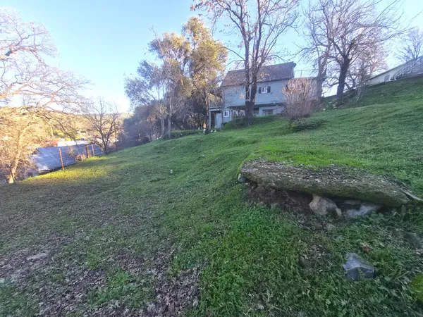 a backyard of a house with lots of green space