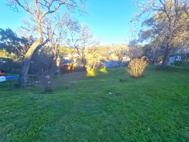 a view of a table and chairs in the garden