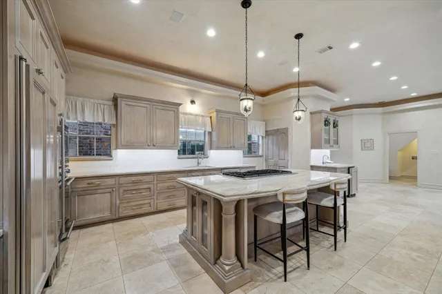 a kitchen with a table and chairs in it