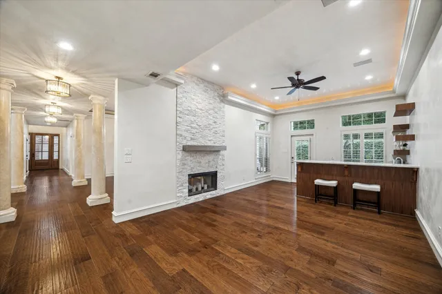 a view of a livingroom with furniture and a window