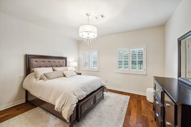 a bedroom with a bed and a table in it