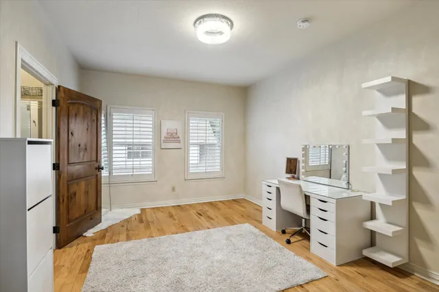 a room with a bed furniture and a window