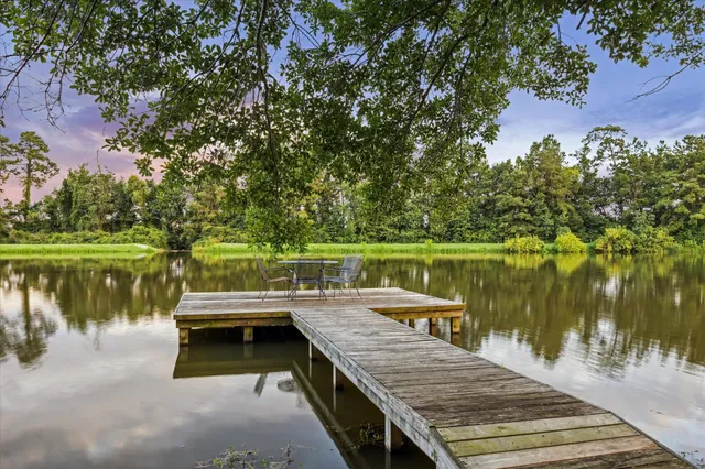 a view of a swimming pool with a yard