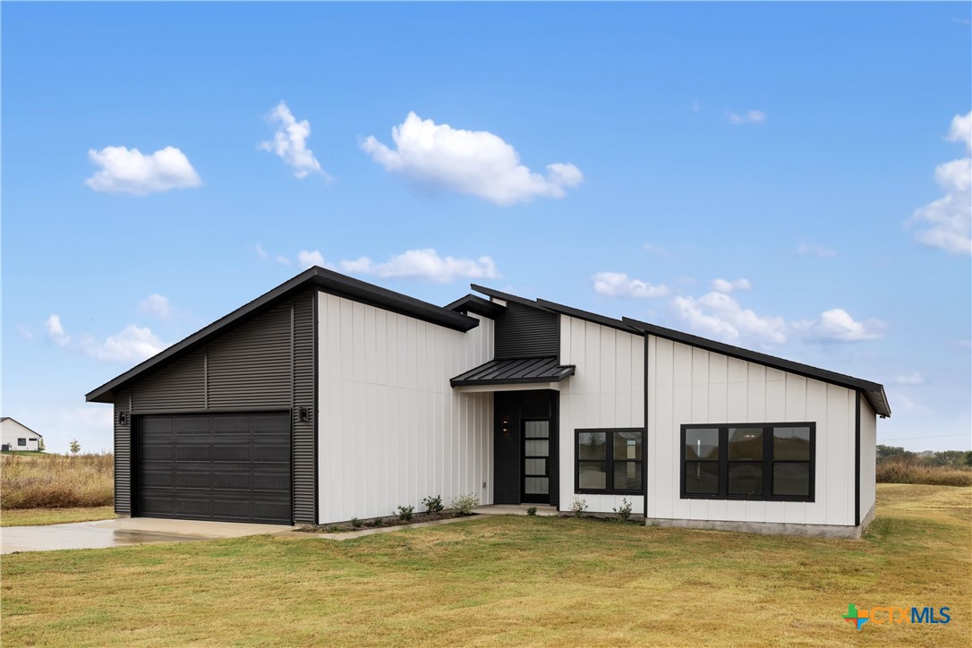 15121 Armstrong Ests Road Salado, TX 76571 - Photo 2 of 45 a view of a house with large windows and a ceiling fan