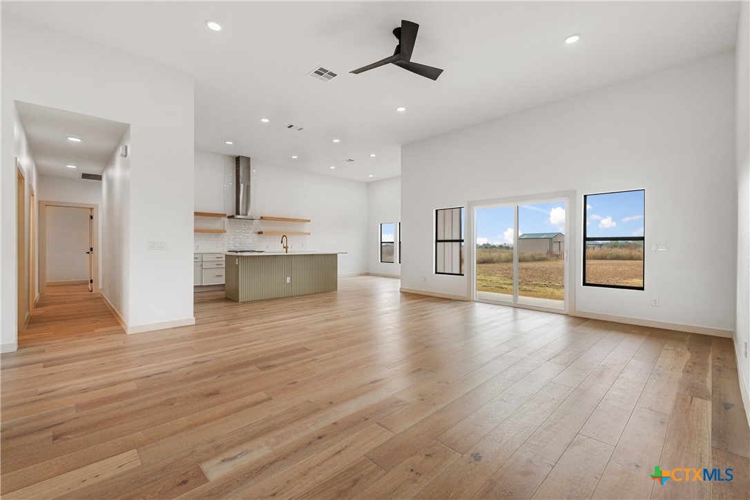 15121 Armstrong Ests Road Salado, TX 76571 - Photo 6 of 45 a view of a kitchen with a sink and a refrigerator