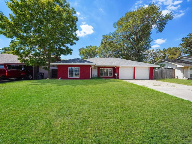 a house view with a garden space