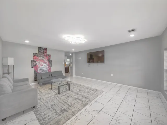 a living room with furniture and rug