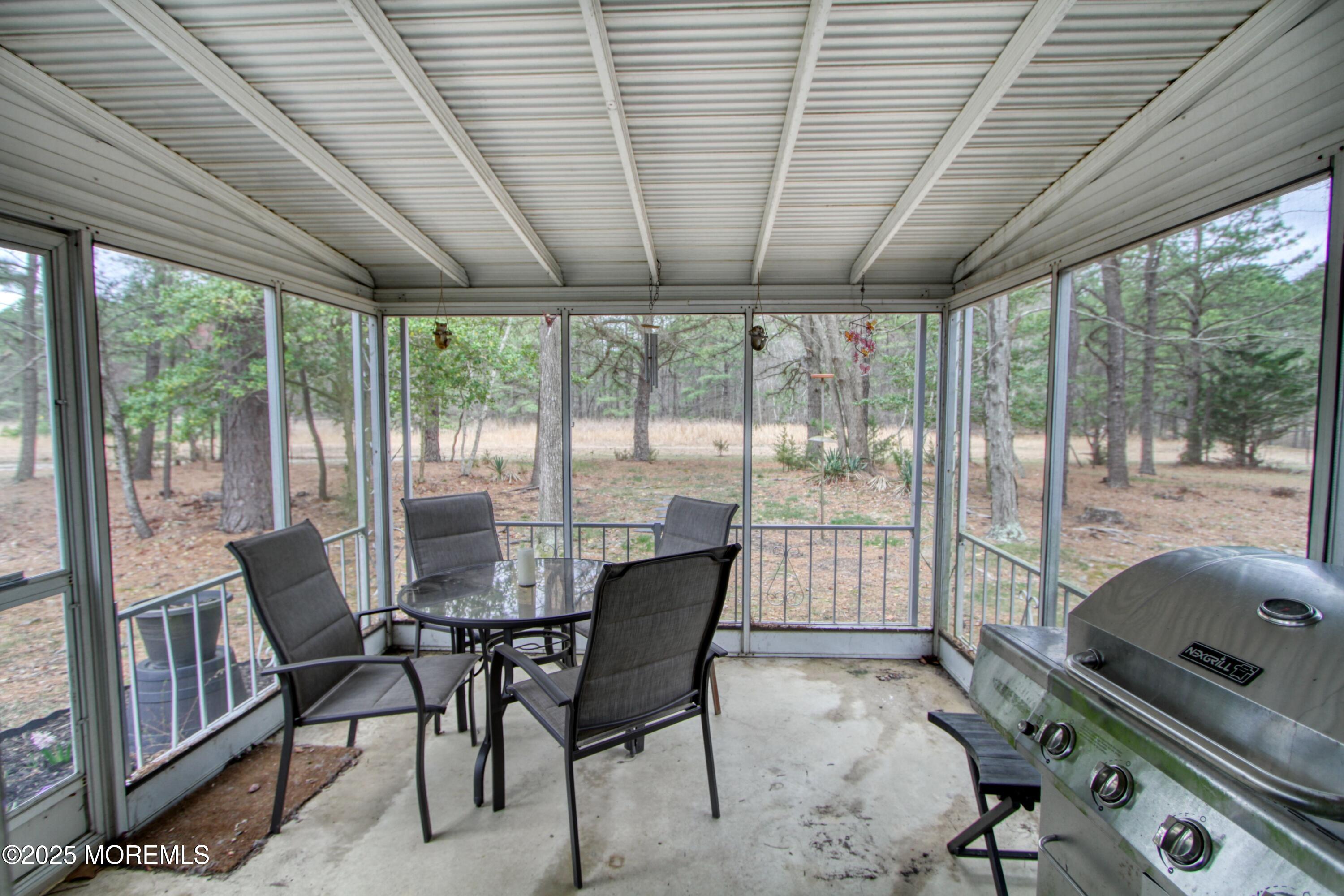 32 Augusta Road Whiting, NJ 08759 - Photo 18 of 30 a dining room with furniture wooden floor and a potted plant