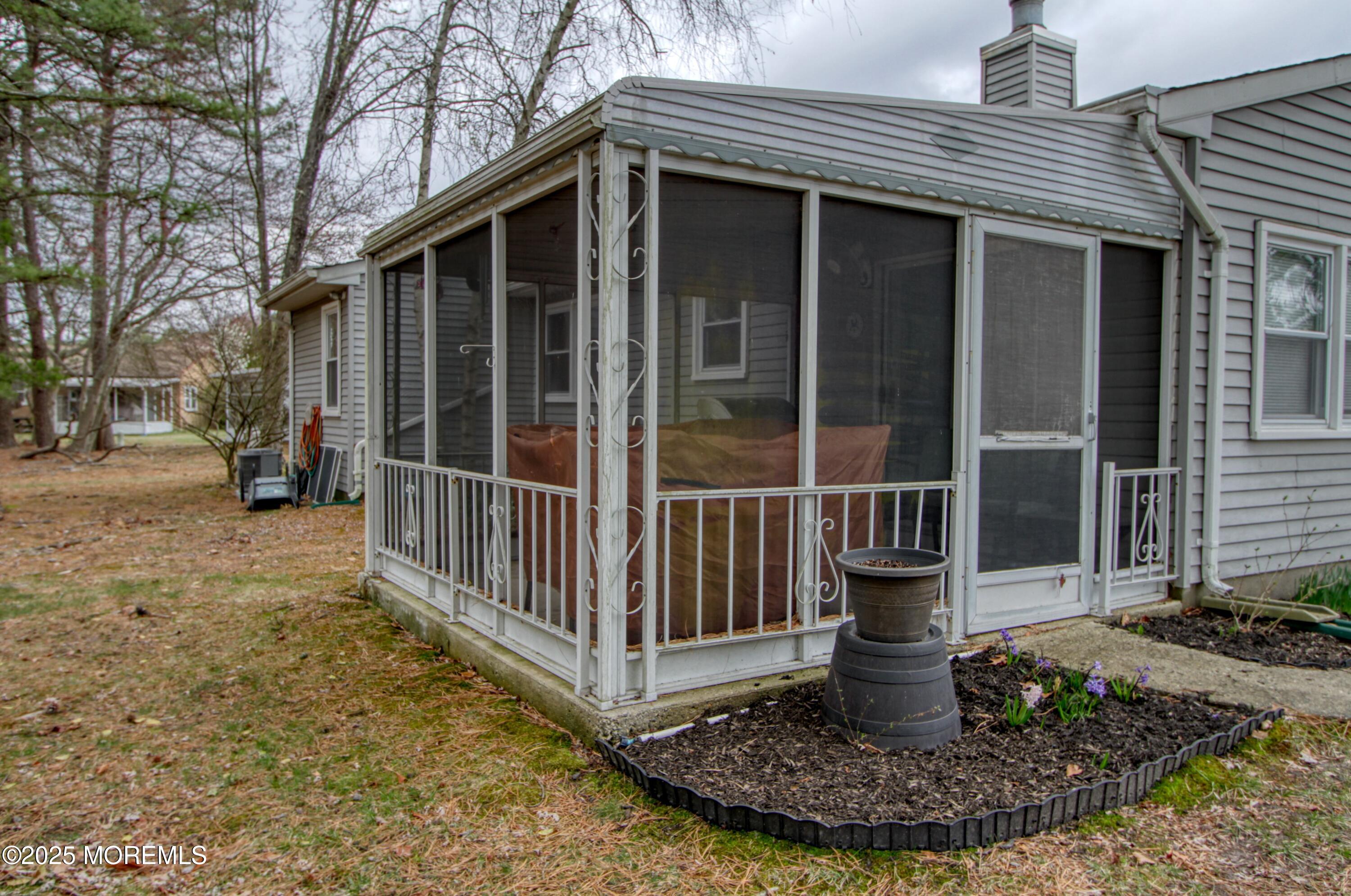 32 Augusta Road Whiting, NJ 08759 - Photo 21 of 30 a view of a house with a yard fire pit and a large tree