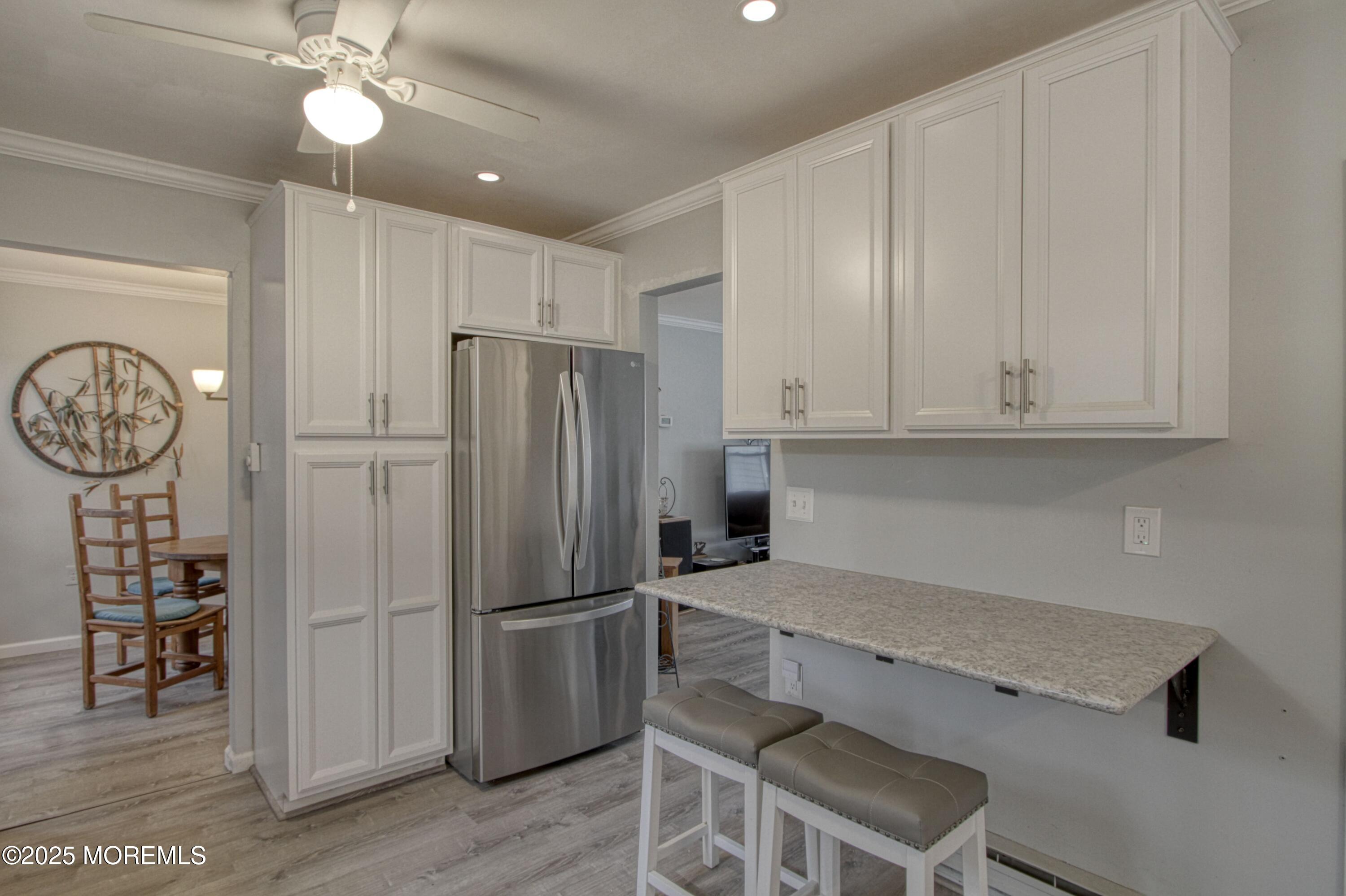 32 Augusta Road Whiting, NJ 08759 - Photo 3 of 30 a kitchen with stainless steel appliances granite countertop a refrigerator and a stove top oven