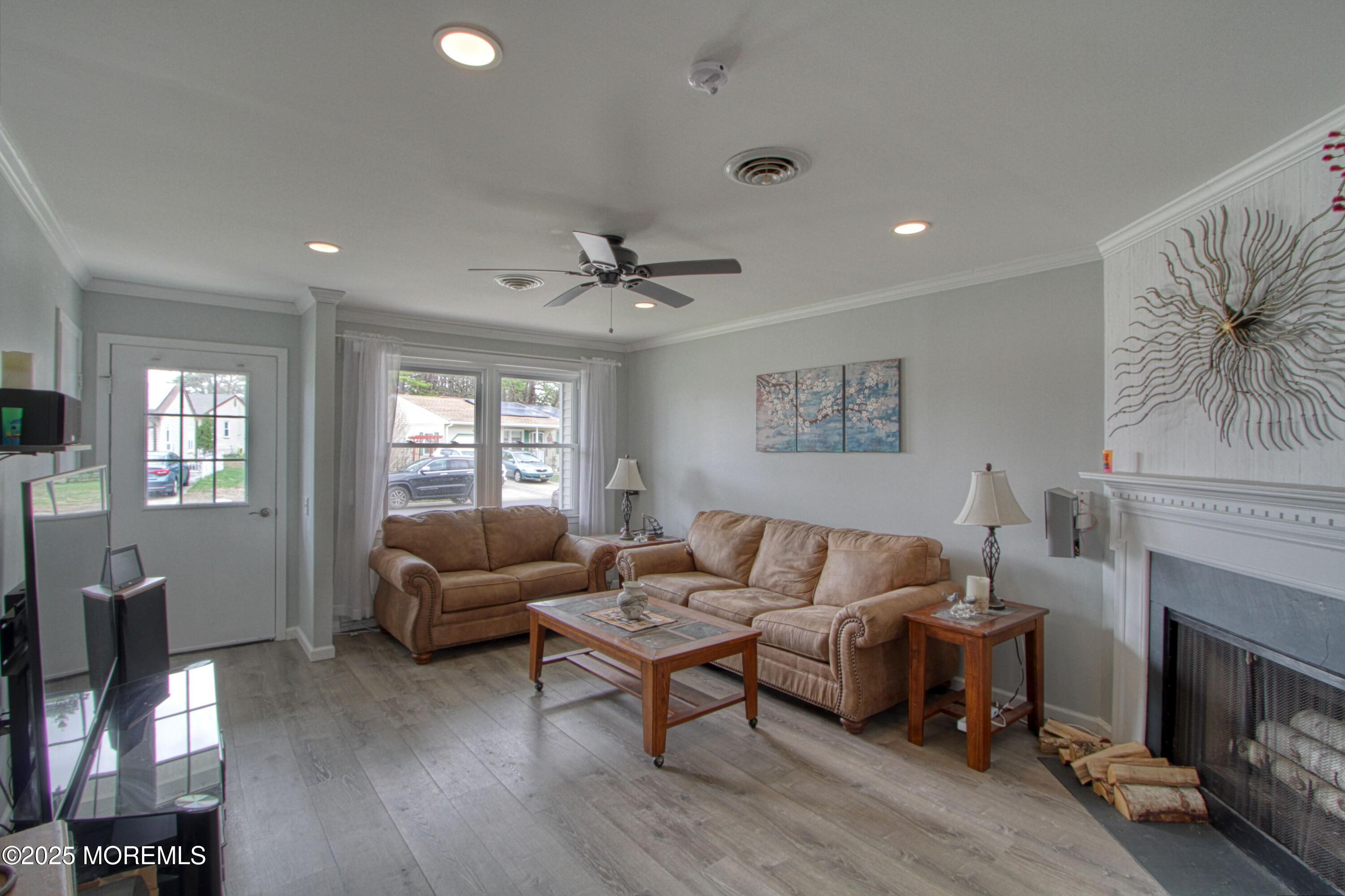 32 Augusta Road Whiting, NJ 08759 - Photo 7 of 30 a living room with furniture and a fireplace