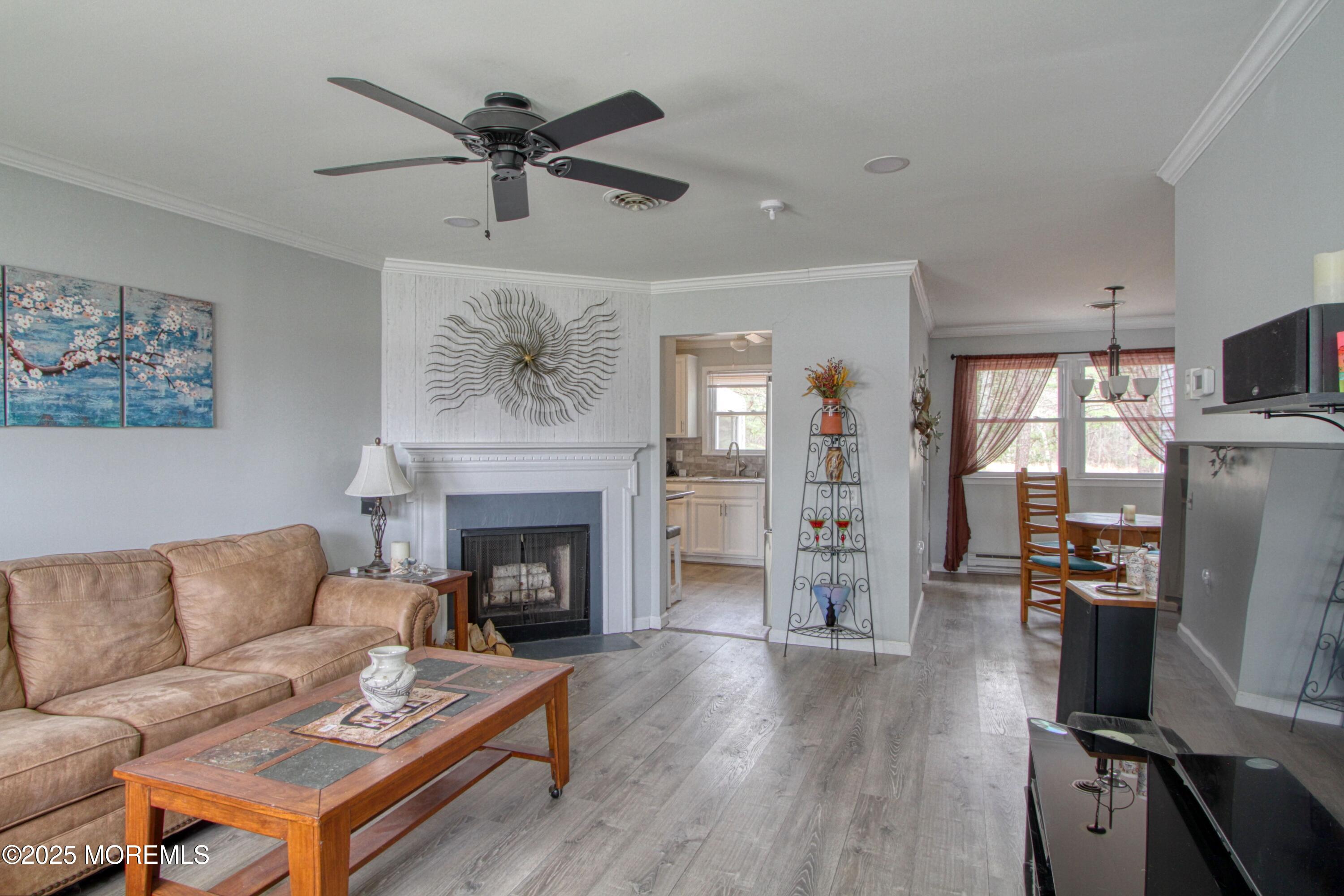 32 Augusta Road Whiting, NJ 08759 - Photo 8 of 30 a living room with furniture a fireplace and a flat screen tv