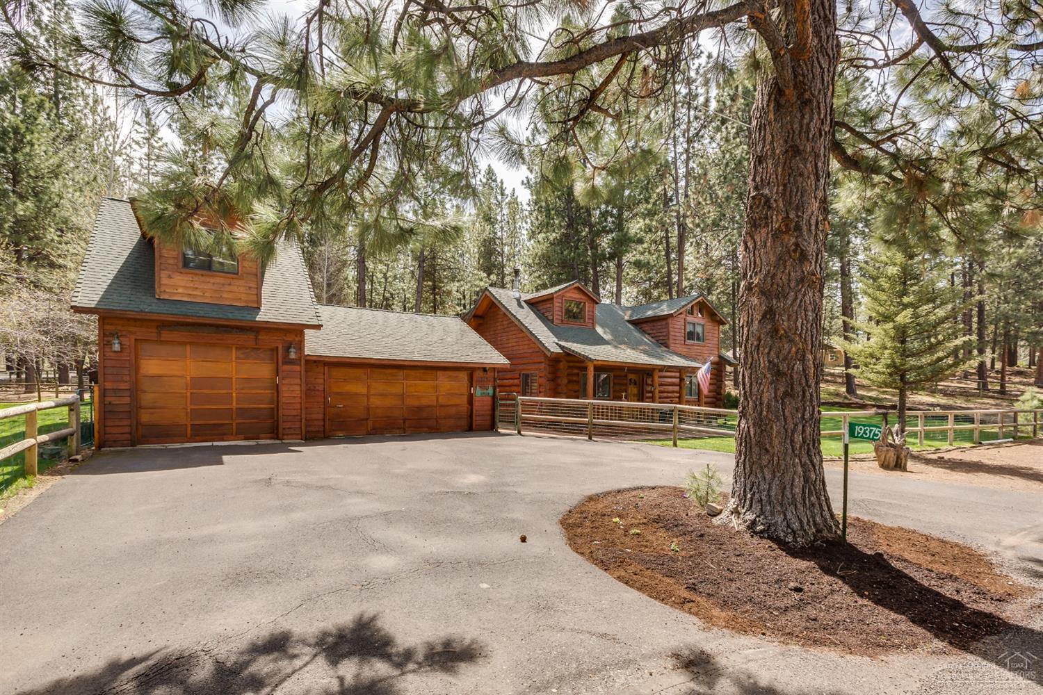 19375 Mohawk Road Bend, OR 97702 - Photo 4 of 25 a front view of a house with a yard and garage