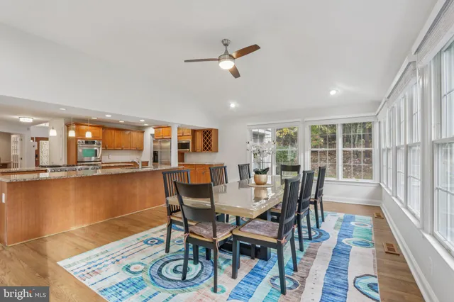 a large kitchen with kitchen island a sink and a stove top oven