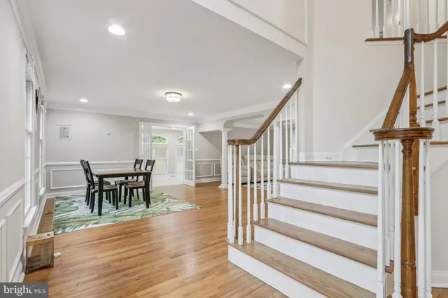 a spacious bedroom with a bed and a window