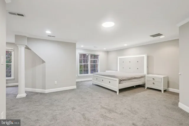 a bed room with a bed and a window