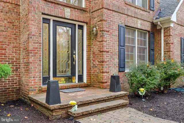 a view of entryway with wooden floor and stairs