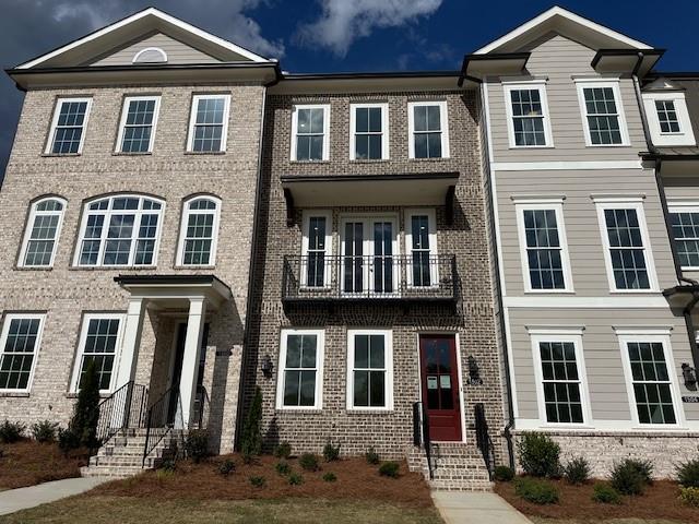 1502 Westend Way, Unit 331 Cumming, GA 30041 - Photo 1 of 38 a front view of a house