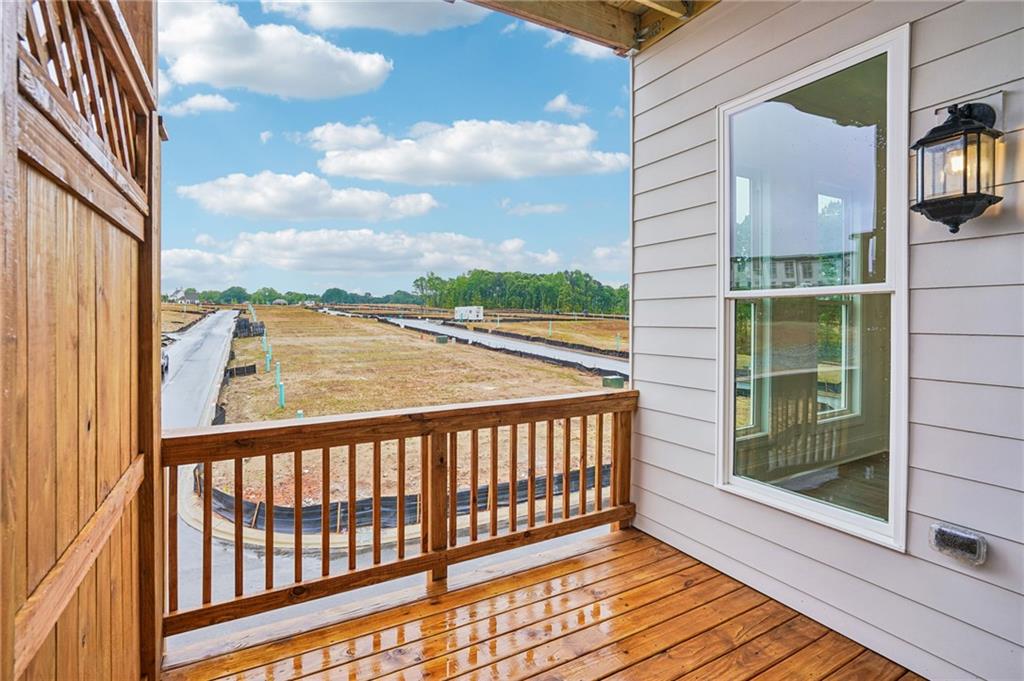 1502 Westend Way, Unit 331 Cumming, GA 30041 - Photo 12 of 38 a view of balcony with wooden floor and fence