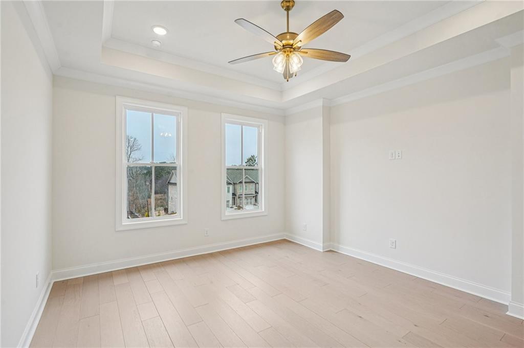 1502 Westend Way, Unit 331 Cumming, GA 30041 - Photo 13 of 38 an empty room with windows and fan