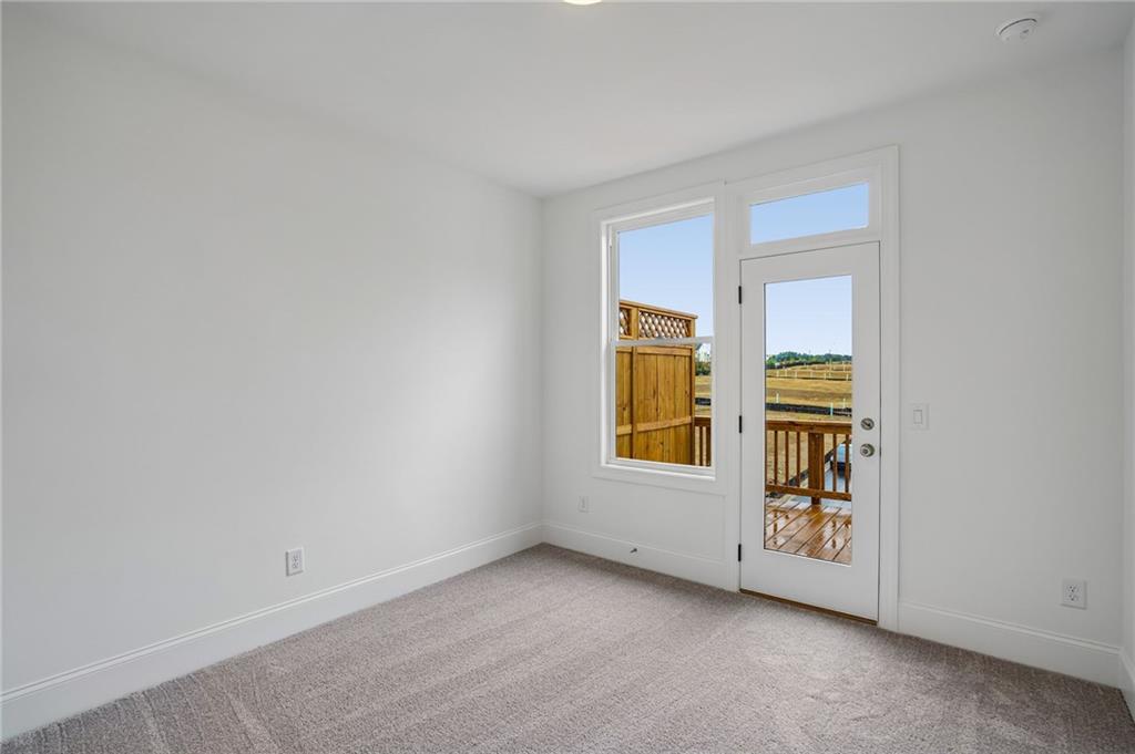 1502 Westend Way, Unit 331 Cumming, GA 30041 - Photo 19 of 38 an empty room with windows