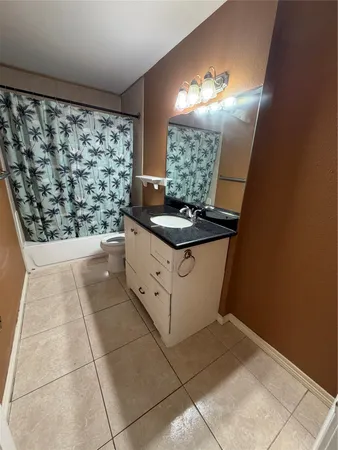 a bedroom with a bed and a lamp with window