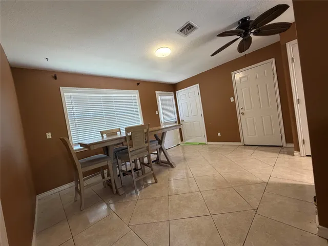 a view of a room with furniture and window