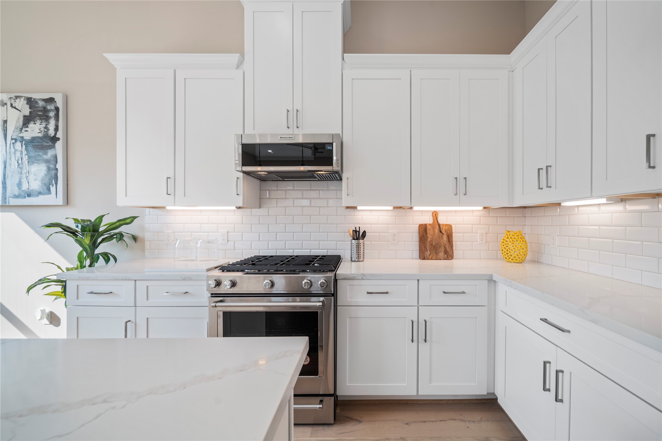 305 Chobani Lane Houston, TX 77091 - Photo 1 of 13 a kitchen with white cabinets and appliances