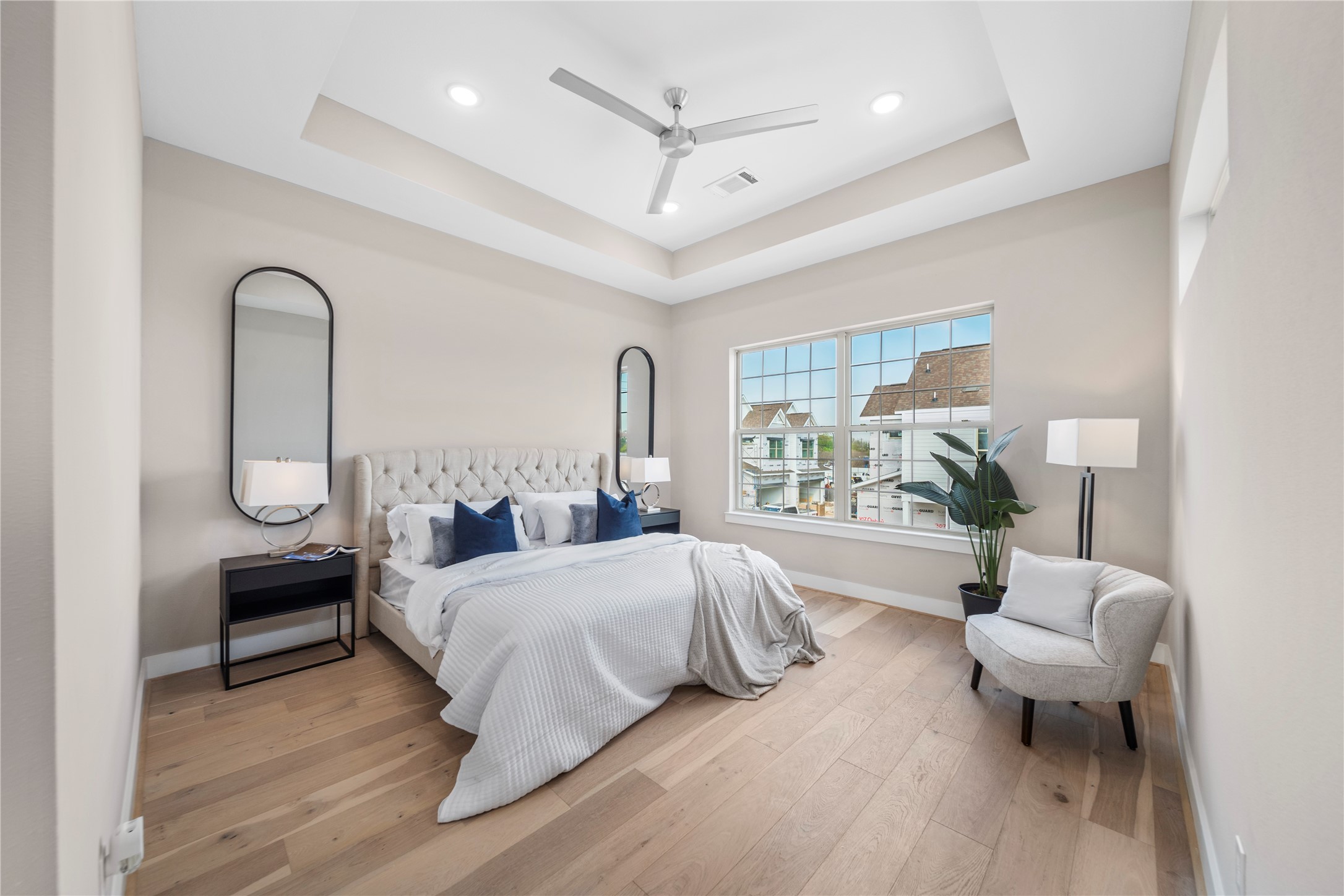 305 Chobani Lane Houston, TX 77091 - Photo 5 of 13 a bedroom with a bed and a potted plant