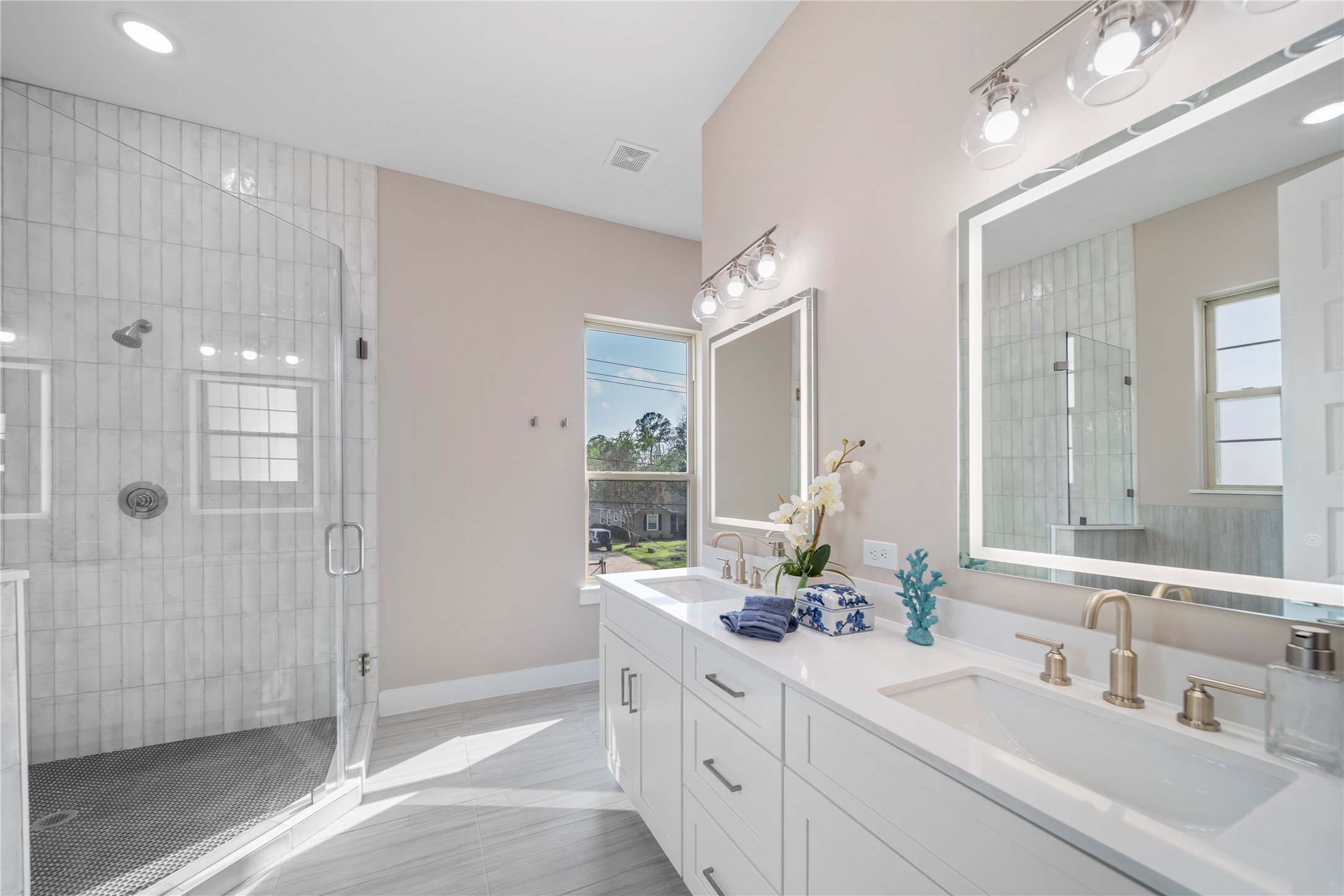 305 Chobani Lane Houston, TX 77091 - Photo 10 of 13 a bathroom with a double vanity sink mirror and shower