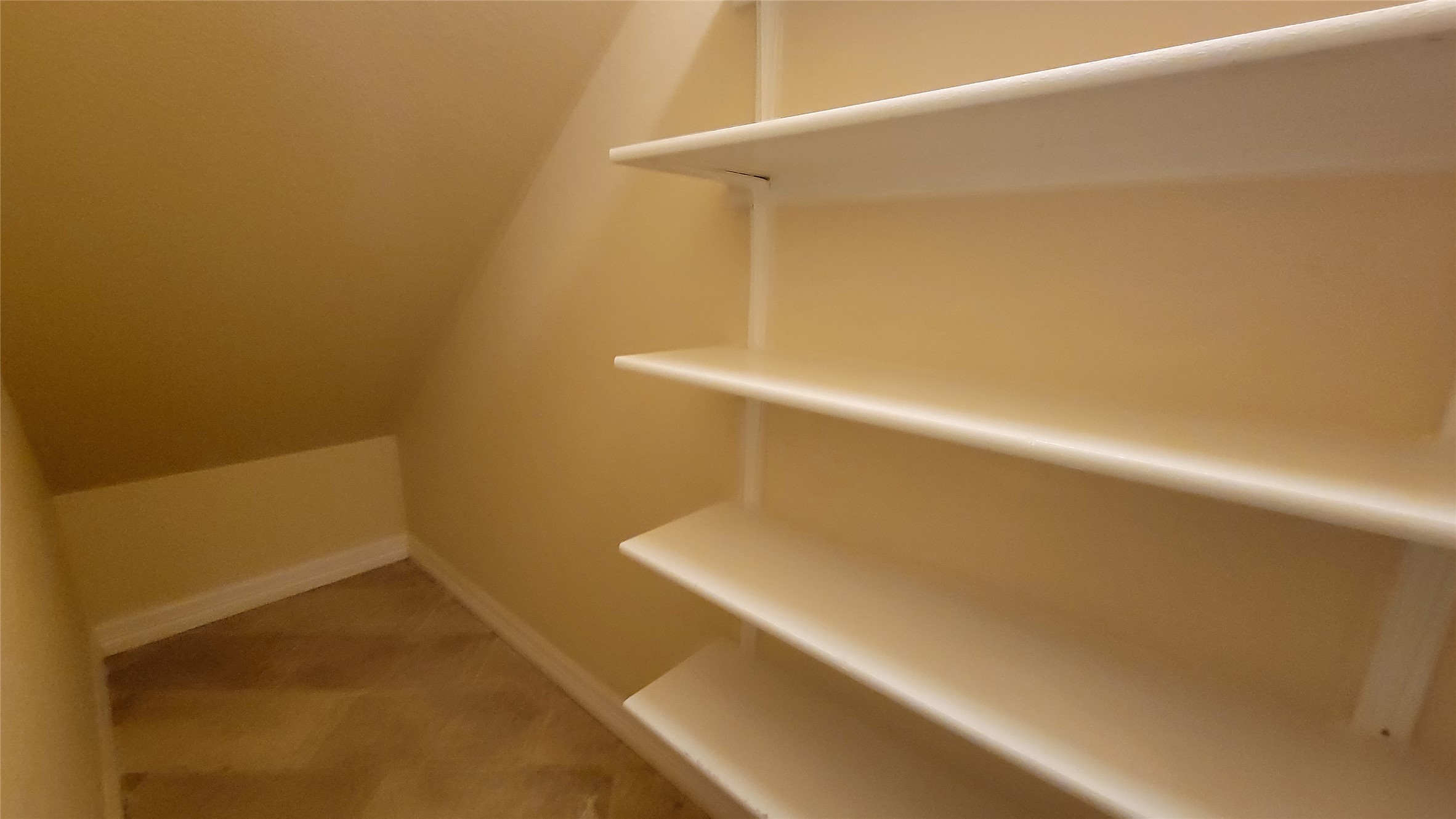 2832 Grimes Ranch Road Austin, TX 78732 - Photo 34 of 37 Built-in shelving provides convenient organization within this neatly appointed storage area.