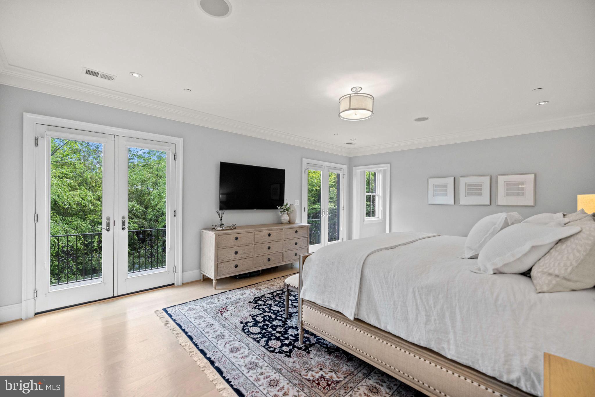 4410 Meadow Road Washington, DC 20007 - Photo 14 of 30 a living room with a flat screen tv and a couch
