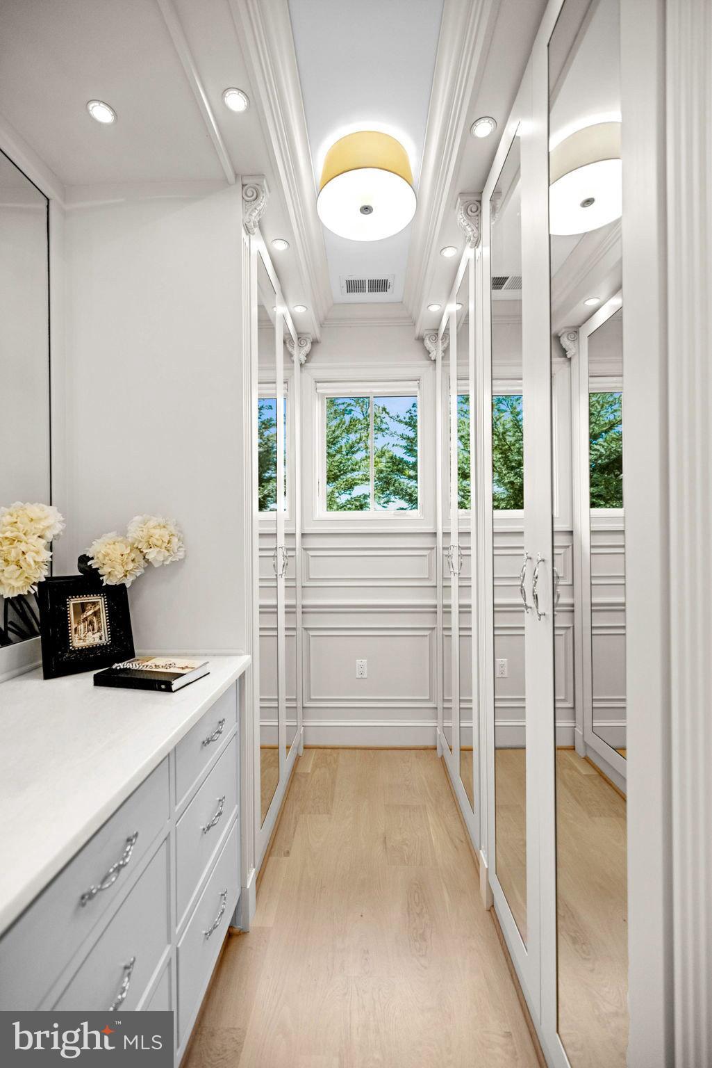 4410 Meadow Road Washington, DC 20007 - Photo 18 of 30 a bathroom with a tub sink and mirror