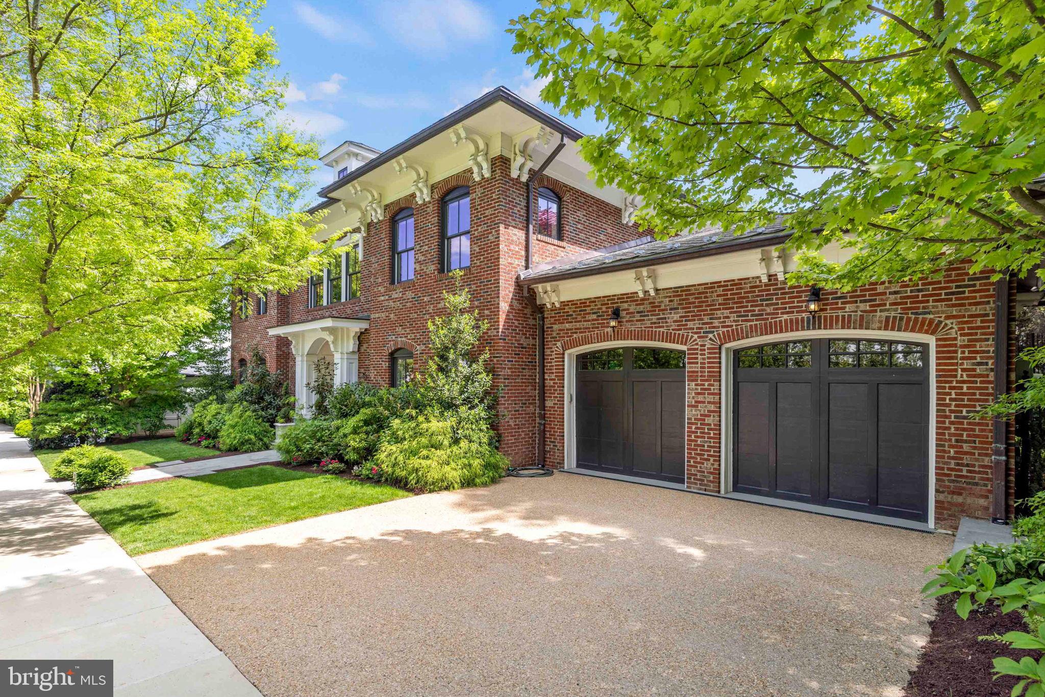 4410 Meadow Road Washington, DC 20007 - Photo 2 of 30 a front view of a house with a yard and garage